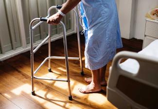 Patient walking with a walker.